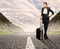 Businesswoman standing on road