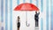 A businesswoman stands near a wall where a businessman draws a giant red umbrella covering them from the rain.