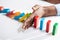 Businesswoman Stopping Dominoes On Desk