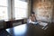 Businesswoman Studying Document In Boardroom