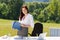 Businesswoman in sunny nature office hold folders