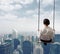 Businesswoman on a swing