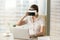 Businesswoman synchronizes VR headset with laptop