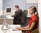 Businesswoman talking on headset at desk