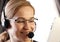 Businesswoman talking on a headset in an office. customer service proffessional.