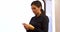 Businesswoman text messaging on mobile phone