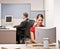 Businesswoman typing on computer at desk