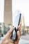 Businesswoman using her mobile phone in front of Building