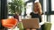 Businesswoman using laptop in reception area