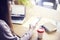 Businesswoman using phone and laptop while sitting in his modern loft office. Concept of young people working mobile devices.