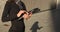 Businesswoman using tablet closeup. Hands of a businesswoman using a tablet. Shadow of a business woman on the asphalt