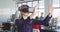 Businesswoman using VR headset in modern office