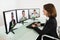 Businesswoman Video Conferencing On Desk