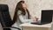 Businesswoman was relaxed at work and fell asleep at the computer. woman in the office yawns in the workplace. tired