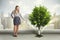 Businesswoman watering green tree on city background