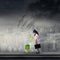 Businesswoman watering plant on rooftop