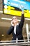 Businesswoman waving at airport