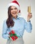 Businesswoman wearing Christmas hat holding shampagne glass.