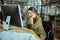 Businesswoman wearing nice red necklace feeling overloaded