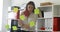 Businesswoman in white blouse considering stickers on glass in office .