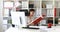 Businesswoman in white blouse examining documents in folder.