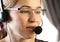 Businesswoman working in a call center. customer service proffessional talking on headset.