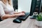 Businesswoman working on a computer from home during pandemic to prevent disease. Remote work. Selective focus. Hands, mouse,