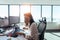 Businesswoman working at her desk in office.