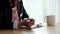 Businesswoman working at home. Woman writing book on the table