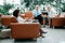 businesswoman works sitting in the spacious lobby of the business center.