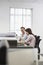 Businesswomen Discussing At Desk In Office