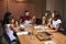 Businesswomen at an evening meeting in a boardroom