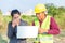 Businesswomen and foreman talking together and happy funny. Engineer and manager teamwork and checking at site construction