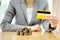 Businesswomen hand with credit card and many coins in column