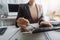 Businesswomen hands working with finances at office in morning light