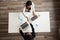 Businesswomen handshaking above office desk making successful de