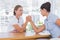 Businesswomen having an arm wrestle