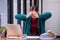 Businesswomen are stressed with work in front of a laptop and paper documents in the office