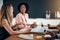 Businesswomen talking together during a meeting in an office boa