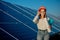 Businesswomen working on checking equipment at solar power plant with tablet checklist, woman working on outdoor at solar power