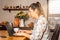 Businesswomen working on laptop from comfort of her home during coronavirus pandemics and quarantine