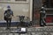 Busker singing and playing guitar near The Cavern Club nightclub birth place of the Beatles in Liverpool, England