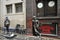 Busker singing and playing guitar near The Cavern Club nightclub birth place of the Beatles in Liverpool, England