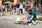 busker street artist percussionist drumming pot cooking pan to play drums