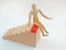 Busness concept wood man model on the top of wood stairs