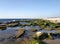 Bustan HaGalil sandy beach with rocks near Acre Haifa Israel. Akko seashore Mediterranean sea. Clear water stones