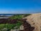 Bustan HaGalil sandy beach with rocks near Acre Haifa Israel. Akko seashore Mediterranean sea. Clear water stones