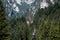 BUSTENI, ROMANIA - AUGUST 2, 2017: Blue cable car cabin transports tourists from Busteni resort up to Bucegi Mountains plateau,