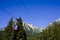 BUSTENI, ROMANIA - AUGUST 2, 2017: Blue cable car cabin transports tourists from Busteni resort up to Bucegi Mountains plateau,