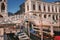 Bustling Grand Canal in Venice, Italy with Gondolas Floating on Water - Tourist Destination View